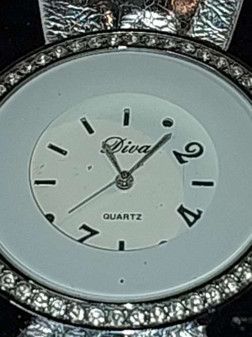 A COLLECTION OF DESIGNER DRESS WATCHES SOLD AS IS NOT TESTED