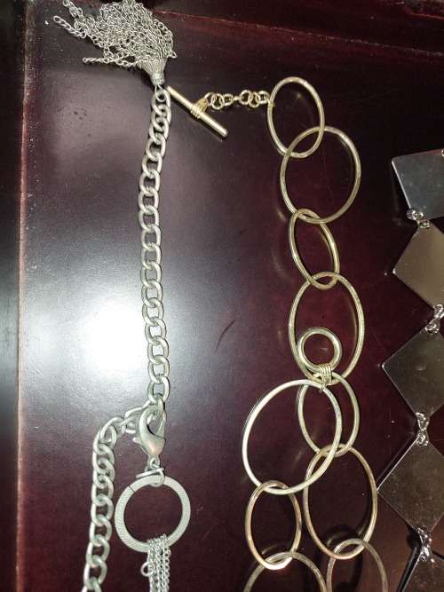 A COLLECTION OF FASHION CHAIN BELTS SOLD AS IS