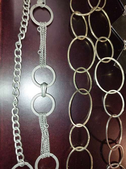 A COLLECTION OF FASHION CHAIN BELTS SOLD AS IS