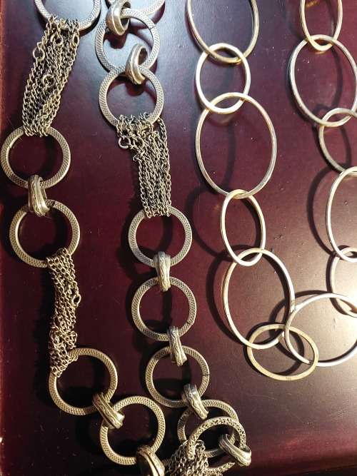 A COLLECTION OF FASHION CHAIN BELTS SOLD AS IS