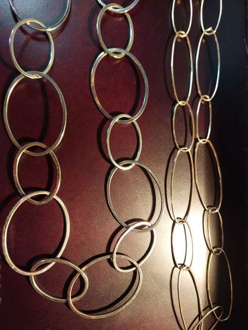 A COLLECTION OF FASHION CHAIN BELTS SOLD AS IS