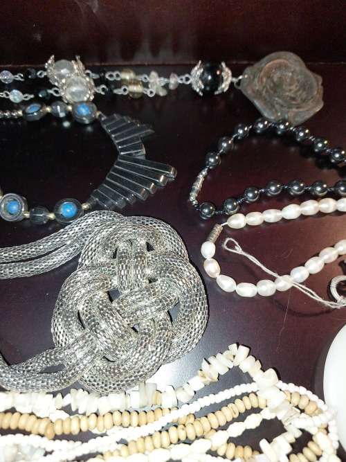 A VINTAGE COLLECTION OF COSTUME JEWELRY SOLD AS IS