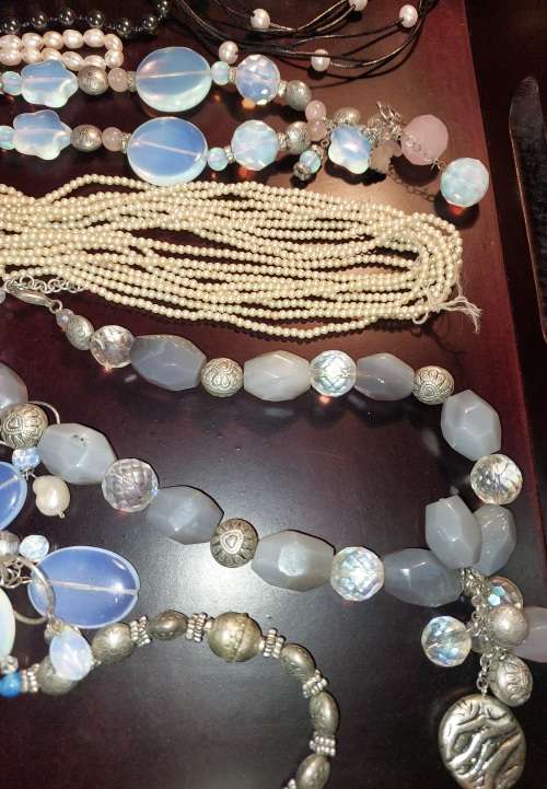 A VINTAGE COLLECTION OF COSTUME JEWELRY SOLD AS IS