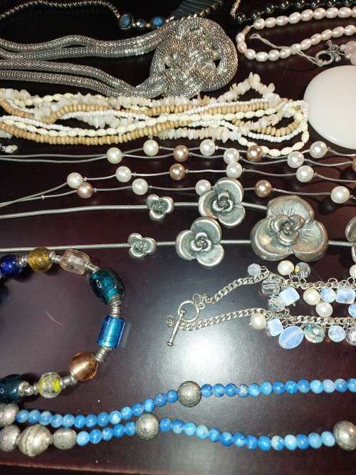 A VINTAGE COLLECTION OF COSTUME JEWELRY SOLD AS IS