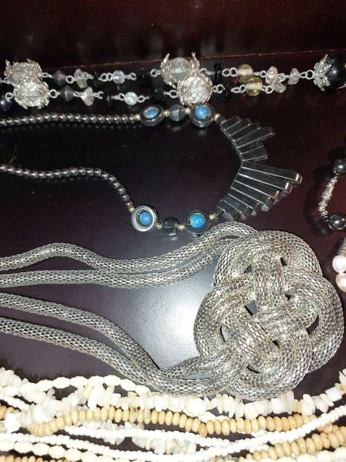 A VINTAGE COLLECTION OF COSTUME JEWELRY SOLD AS IS