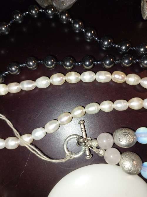 A VINTAGE COLLECTION OF COSTUME JEWELRY SOLD AS IS