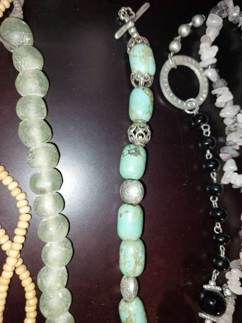 A COLLECTION OF VINTAGE COSTUME NECKLACES SOLD AS IS