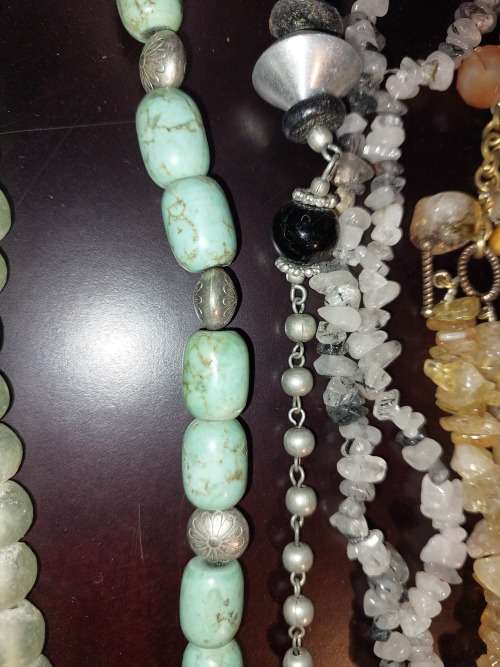 A COLLECTION OF VINTAGE COSTUME NECKLACES SOLD AS IS