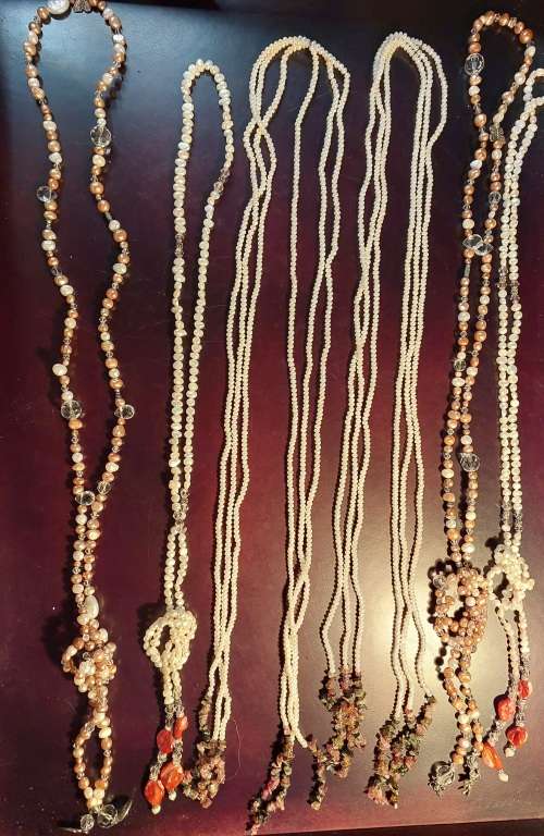 A COLLECTION OF PEARL NECKLACES IN PERFECT CONDITION SOLD AS IS