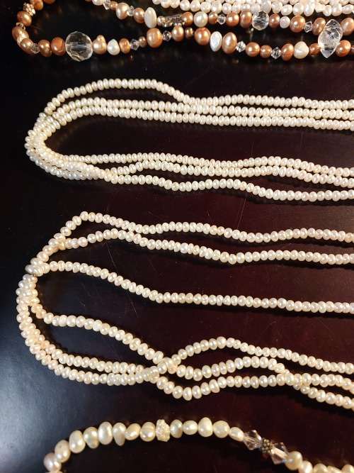 A COLLECTION OF PEARL NECKLACES IN PERFECT CONDITION SOLD AS IS