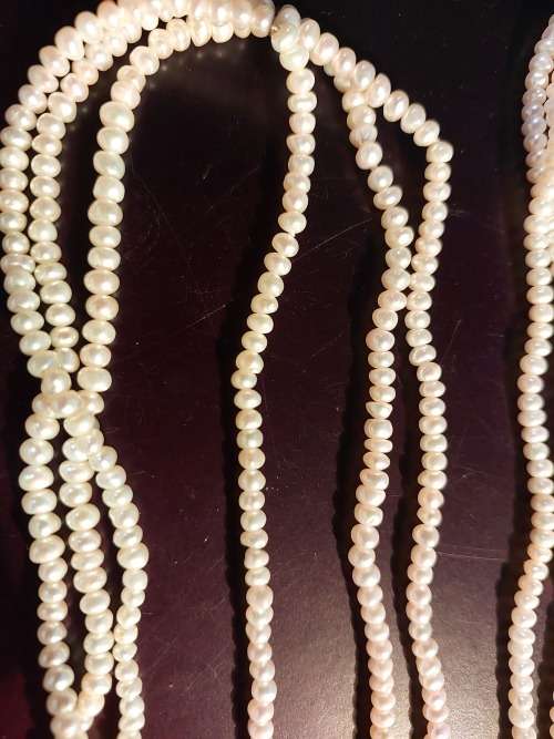 A COLLECTION OF PEARL NECKLACES IN PERFECT CONDITION SOLD AS IS