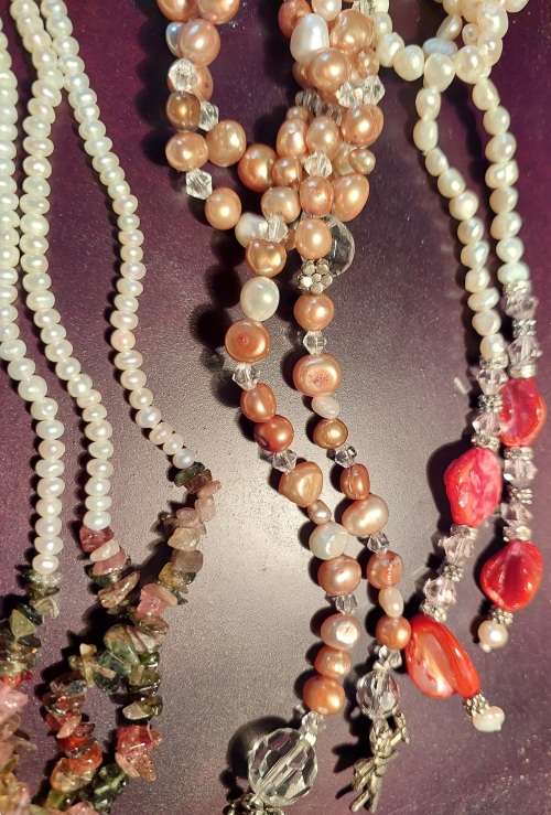 A COLLECTION OF PEARL NECKLACES IN PERFECT CONDITION SOLD AS IS
