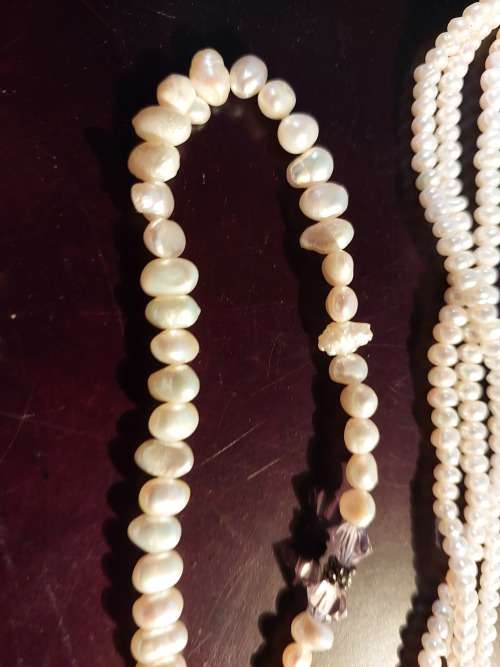 A COLLECTION OF PEARL NECKLACES IN PERFECT CONDITION SOLD AS IS
