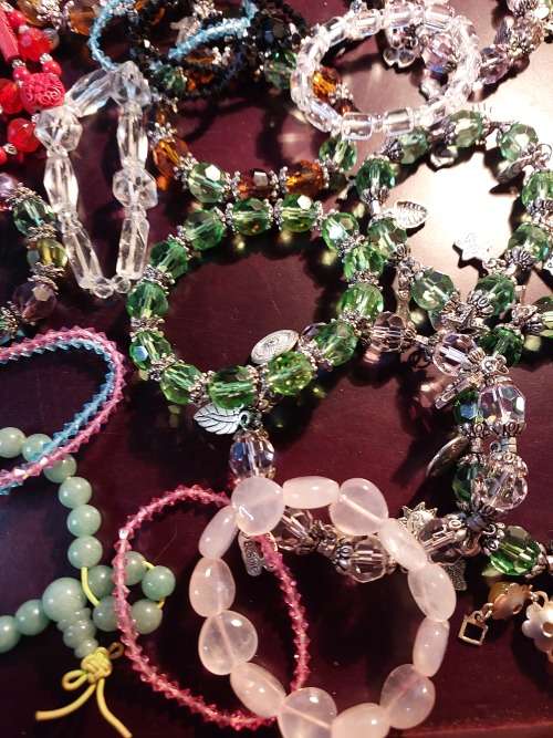 A JOB LOT COSTUME BRACELETS AND GOLD PLATED BANGLES SOLD AS IS