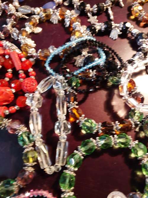 A JOB LOT COSTUME BRACELETS AND GOLD PLATED BANGLES SOLD AS IS