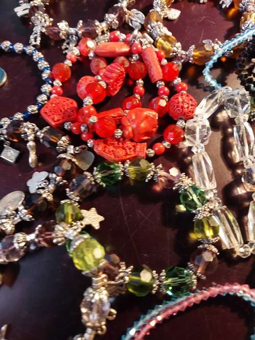A JOB LOT COSTUME BRACELETS AND GOLD PLATED BANGLES SOLD AS IS
