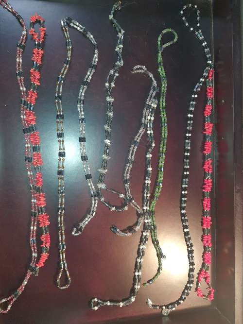 A COLLECTION OF MEGNATIC COSTUME NECKLACES SOLD AS IS