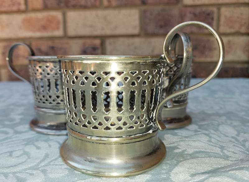 A SET OF 3 HOT GLASS TEA OR COFFEE GLASS EPNS HOLDERS