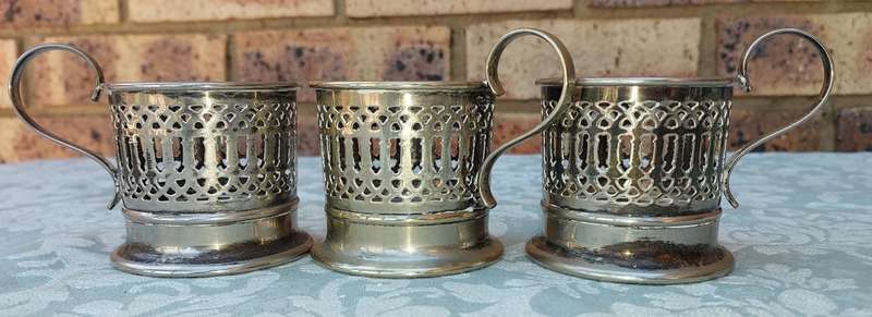 A SET OF 3 HOT GLASS TEA OR COFFEE GLASS EPNS HOLDERS