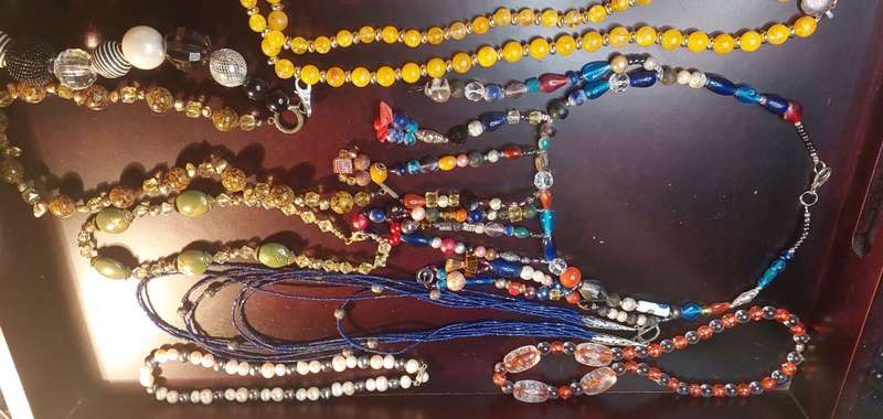 A COLLECTION OF COSTUME NECKLACES SOLD AS IS