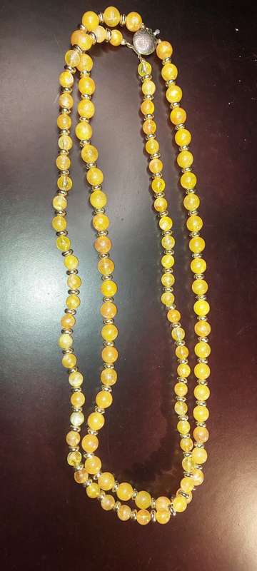 A COLLECTION OF COSTUME NECKLACES SOLD AS IS
