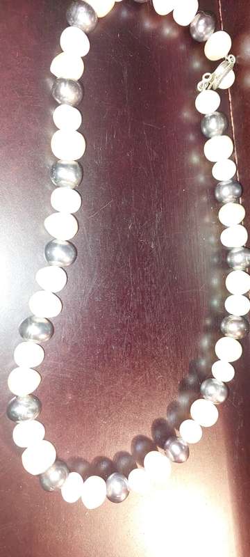 A COLLECTION OF COSTUME NECKLACES SOLD AS IS