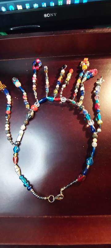 A COLLECTION OF COSTUME NECKLACES SOLD AS IS