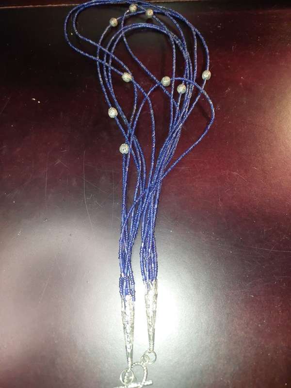 A COLLECTION OF COSTUME NECKLACES SOLD AS IS