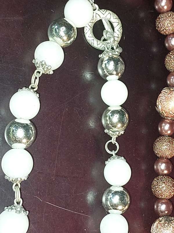A COLLECTION OF COSTUME NECKLACES SOLD AS IS