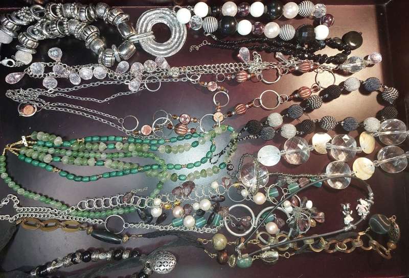 A COLLECTION OF FASHION  COSTUME NECKLACES SOLD AS IS