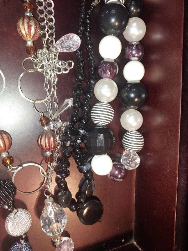 A COLLECTION OF FASHION  COSTUME NECKLACES SOLD AS IS