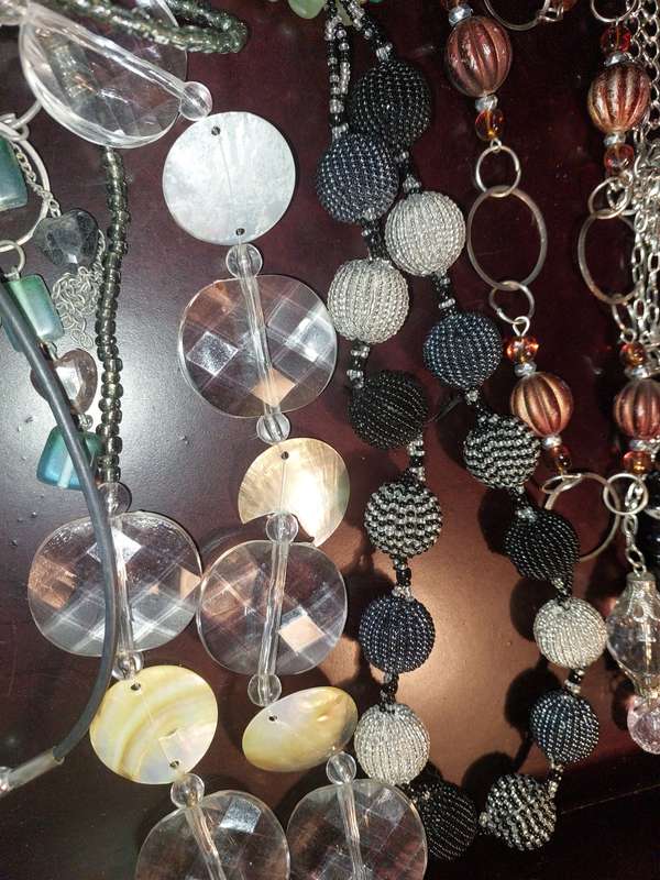 A COLLECTION OF FASHION  COSTUME NECKLACES SOLD AS IS