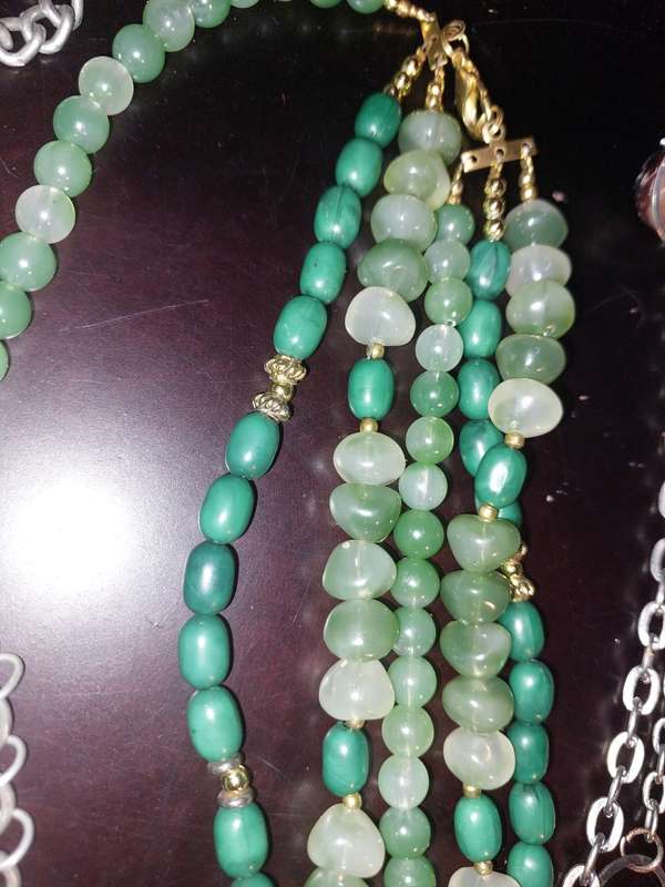 A COLLECTION OF FASHION  COSTUME NECKLACES SOLD AS IS