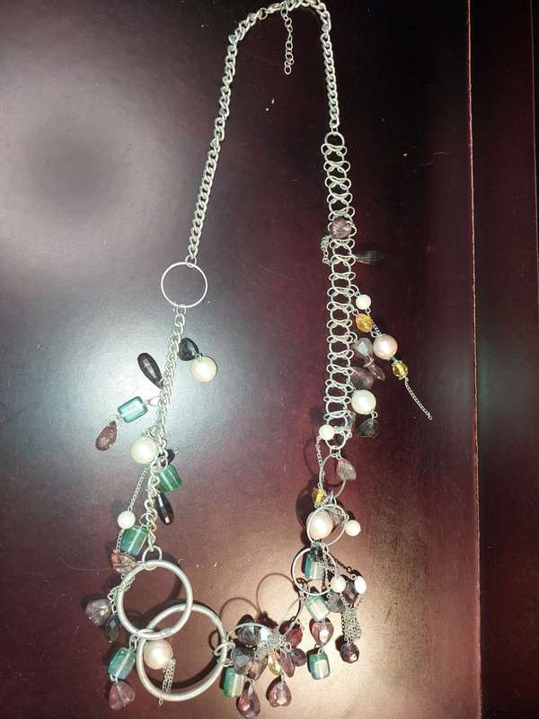 A COLLECTION OF FASHION  COSTUME NECKLACES SOLD AS IS