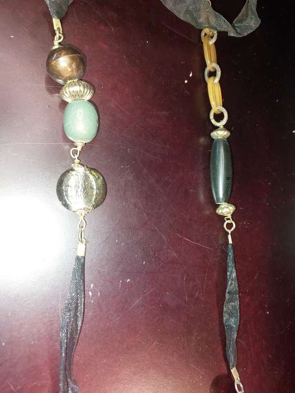 A COLLECTION OF FASHION  COSTUME NECKLACES SOLD AS IS