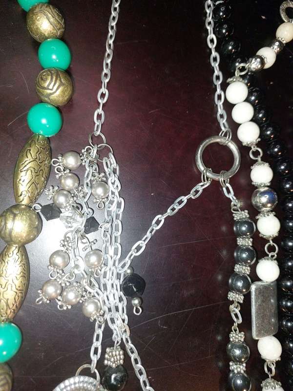 A COLLECTION OF VINTAGE COSTUME NECKLACES SOLD AS IS