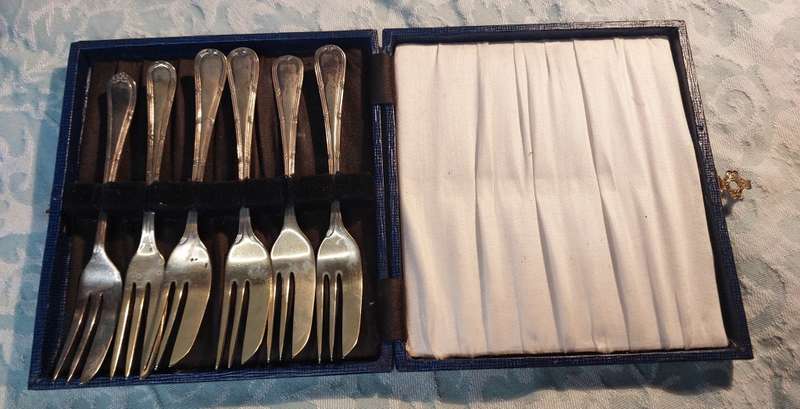 AN ANTIQUE SET OF EPNS COCKTAIL FORKS