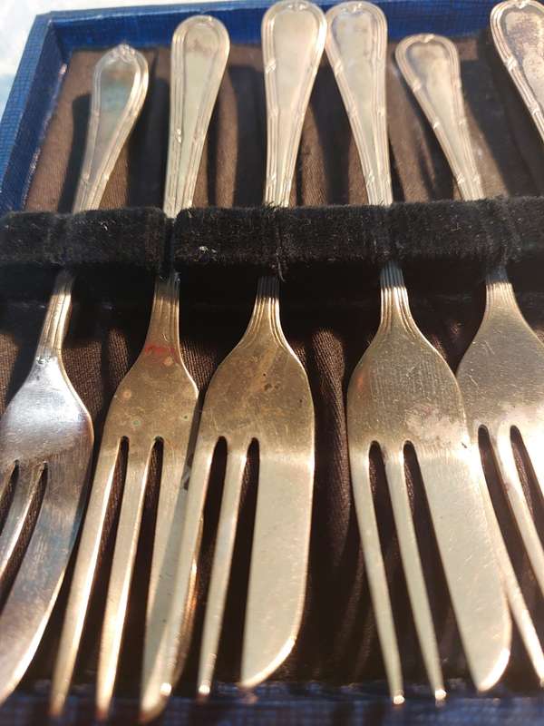 AN ANTIQUE SET OF EPNS COCKTAIL FORKS