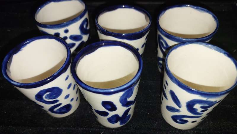 A SET OF SIX DUTCH PORCELAIN CERAMIC SHOT CUPS SOLD AS IS