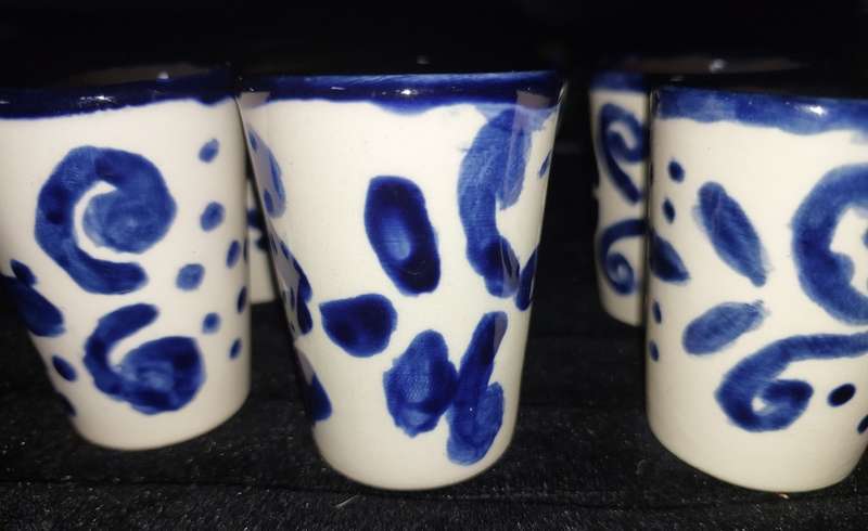 A SET OF SIX DUTCH PORCELAIN CERAMIC SHOT CUPS SOLD AS IS