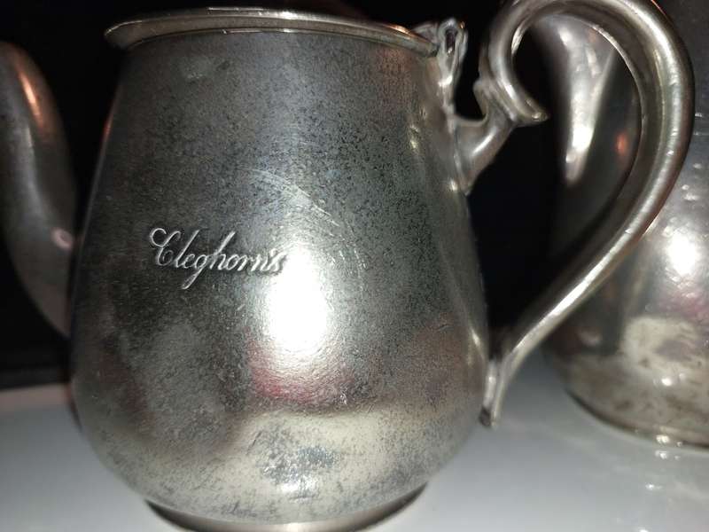 A VICTORIAN SET OF THREE ELKINGTON PLATE CLEGHORNS TEA POTS AND MILK JUG