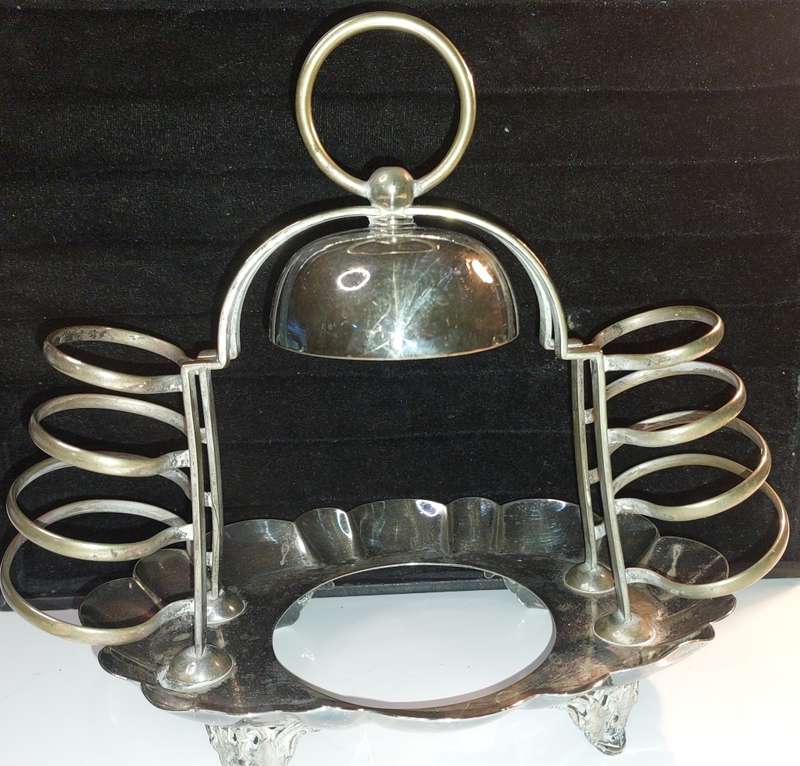 A VINTAGE BREAKFAST TOAST  SERVING STAND SILVER PLATED  SOLD AS IS