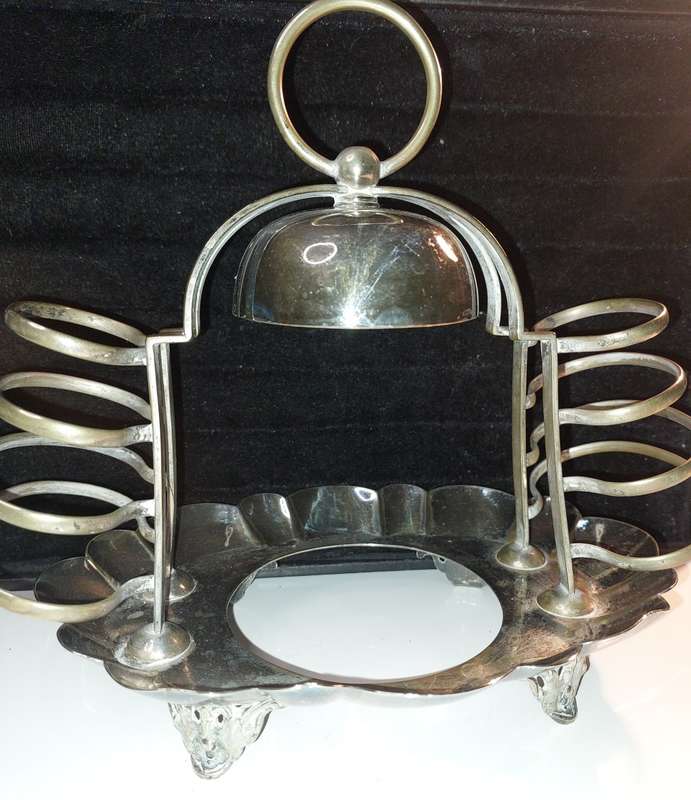 A VINTAGE BREAKFAST TOAST  SERVING STAND SILVER PLATED  SOLD AS IS