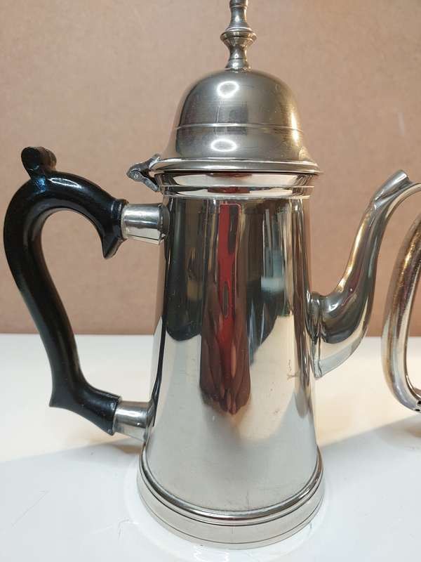 TWO VINTAGE SILVER PLATED TEAPOTS SOLD AS IS