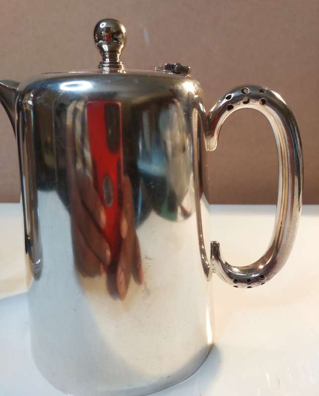 TWO VINTAGE SILVER PLATED TEAPOTS SOLD AS IS