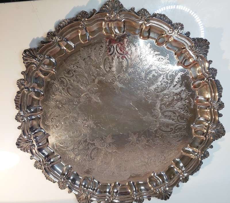 A VINTAGE 43 TO 44-CENTIMETER VICTORIAN SILVER PLATED WITH ORNATE DESIGNS SERVING TRAY