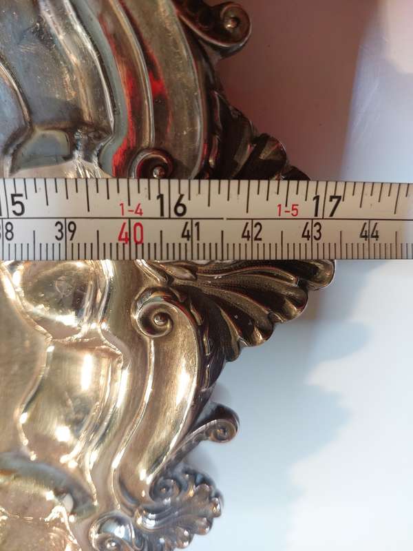 A VINTAGE 43 TO 44-CENTIMETER VICTORIAN SILVER PLATED WITH ORNATE DESIGNS SERVING TRAY
