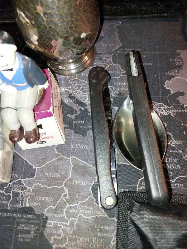A COLLECTION OF FLASKS CIGARETTE LIGHTERS  POCKET KNIVES AND A LEATHER CIGARETTE HOLDER SOLD AS IS