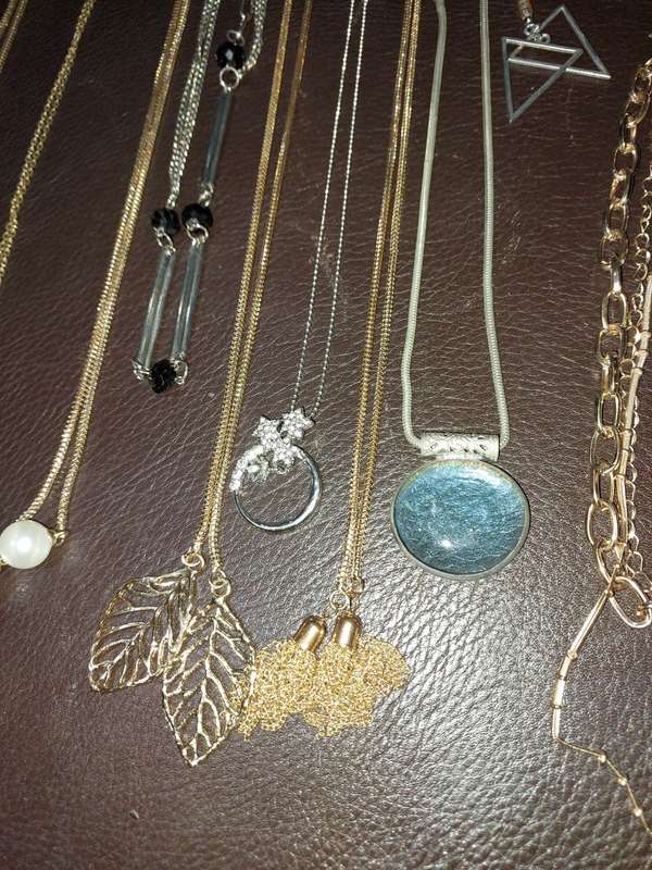 A  VINTAGE COLLECTION OF GOLD PLATED AND SILVER PLATED NECKLACES