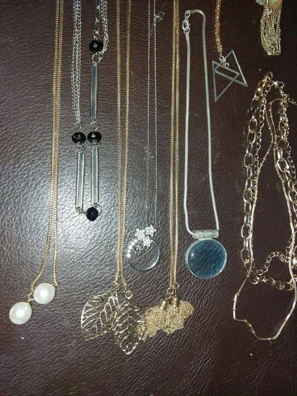 A  VINTAGE COLLECTION OF GOLD PLATED AND SILVER PLATED NECKLACES